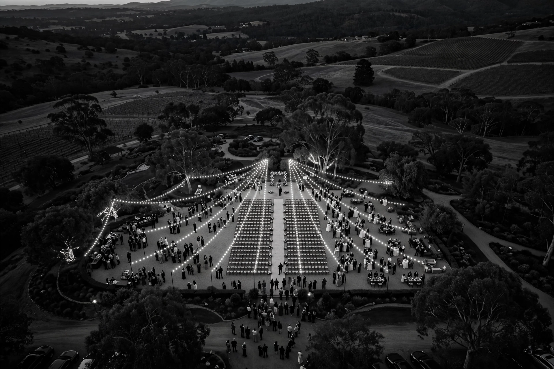Aerial view of an outdoor event at dusk